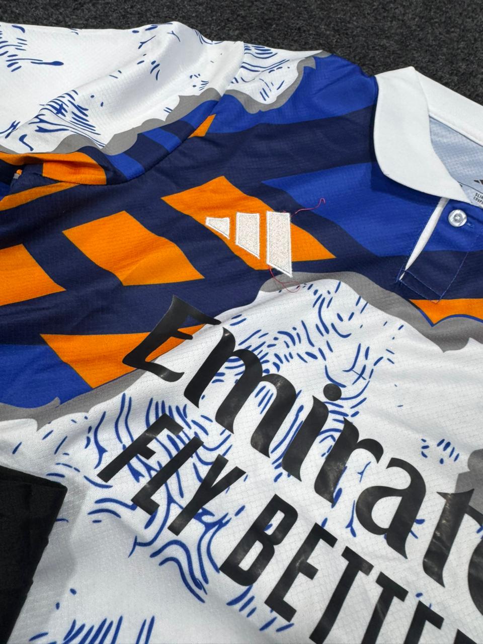 REAL MADRID BLUE & ORANGE SPECIAL EDITION FOOTBALL KIT SET (WITH SHORTS) – 2024/25